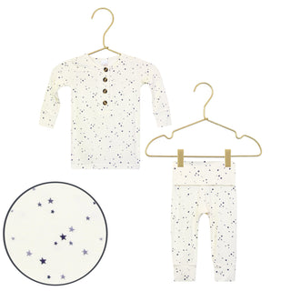 Lou Lou and Company Top and Bottoms - George
Baby onesie and pants with star pattern on hangers against a white background