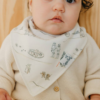 Copper Pearl Star Wars Tatooine™ Bandana Bib Set
Baby wearing a bandana with Star Wars illustrations and a visible brand logo.