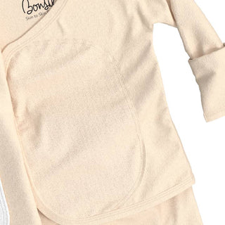 Bonsie Footie - Oat
Beige long-sleeve top with 'Bodily' branding on a white background