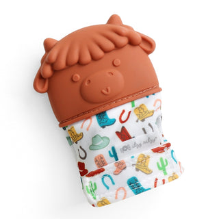 Itzy Ritzy Teething Mitt - Highland Cow Silicone teether with cowgirl design on a white background