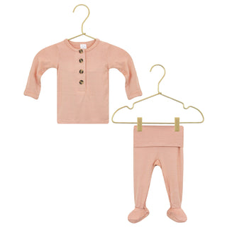 Lou Lou and Company Top and Bottoms - Abby
Pink baby shirt and pants set on hangers against a white background