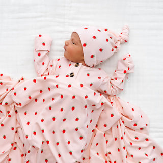Lou Lou and Company Top and Bottoms - Junie
Newborn baby in pink outfit with red strawberry pattern on a white background