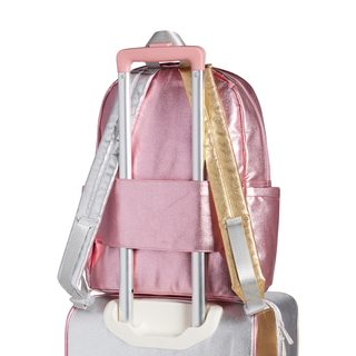 State Bags Kane Backpack - Pink / Silver Pink backpack with a gold strap on a white background