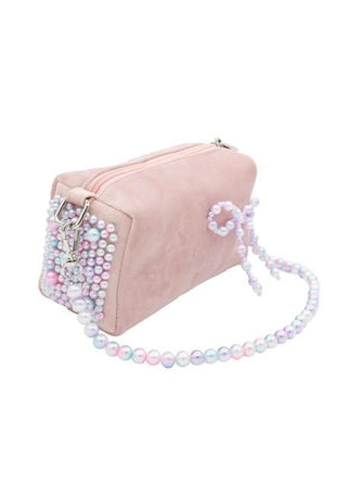 Bari Lynn Velvet Bag with Pearl Bow & Handle - Pink
Pink handbag with pearl embellishments on a white background