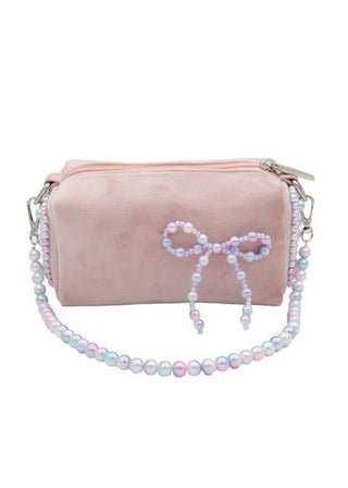 Bari Lynn Velvet Bag with Pearl Bow & Handle - Pink
Pink handbag with a beaded bow on a white background