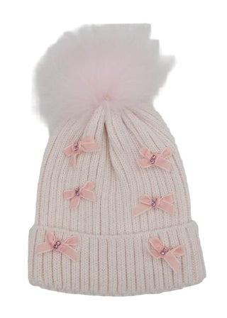 Bari Lynn Small Velvet Bow on Ribbed Fur Pom Hat - Light Pink
Knitted beanie with pink bow decorations on a light gray background