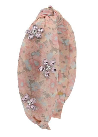 Pink Bari Lynn floral print knot headband with jewel accents, featuring a stylish and decorative accessory for hair.