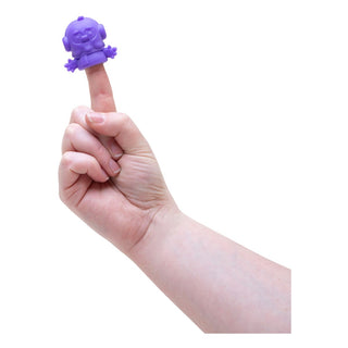 Nee Doh Squishmas 2025 Advent Calendar
Hand holding a small purple creature on a finger against a white background