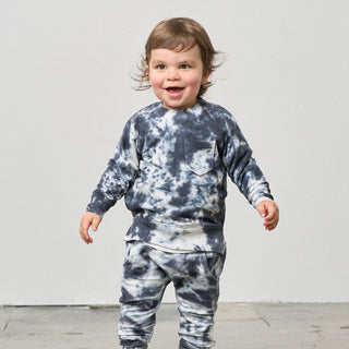 Little Bipsy Marble Pullover - Blue
Child wearing a tie-dye outfit against a plain background