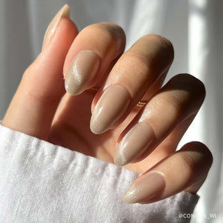Glamnetic Press-On Nails Short Almond - Honey Bun
Close-up of a hand with beige nail polish on a white background
