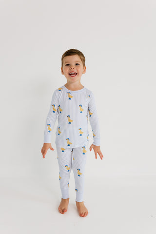 In My Jammers Two Piece Set - Striped Ducks
Child wearing a blue pajama set with duck pattern on a white background