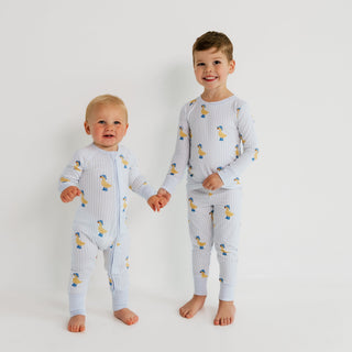 In My Jammers Zipper Romper - Striped Ducks
Two children wearing matching pajamas with a pattern on a white background