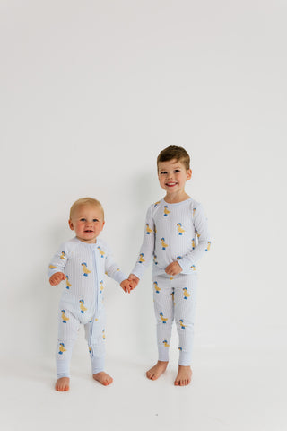 In My Jammers Two Piece Set - Striped Ducks
Two children wearing matching pajamas with a duck pattern on a white background