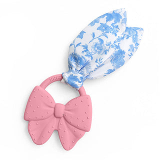 Itzy Ritzy Crinkle Crew™ bow teether for babies, soft fabric with crinkle texture and colorful design for sensory play.