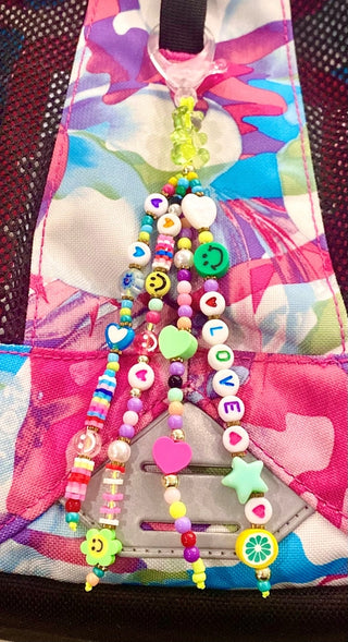 Sunshine & Glitter Adorbs Bag Charm keychain with colorful glitter and sunshine design, attached to a metallic clip.