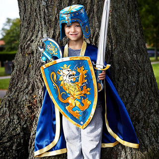 Liontouch Sword - Noble Knight Sword: Blue
Child in a blue knight costume with a sword and shield standing against a tree.