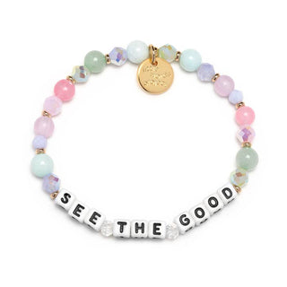 Little Words Project bracelet featuring "See The Good" message with a sweet bakery-themed charm and colorful beaded design.