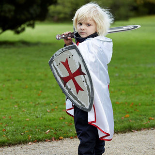 Liontouch Sword -  Maltese Knight
Child in a knight costume holding a shield and sword outdoors.
