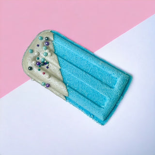 The Lavish Goat Popsicle Prize Bath Bomb - Blue
Blue inflatable pool raft with decorative elements on a pink and white background