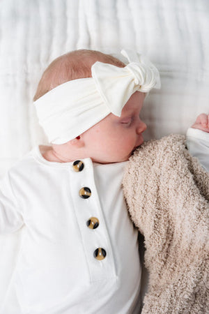 Lou Lou and Company Finley knit headband with soft, cozy fabric and stylish design for infants and toddlers.