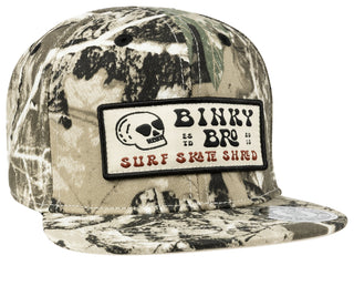 BinkyBro Kids Tiree Camo Hat
Camouflage cap with a patch featuring 'Binky & Bro Surf & Skate' on a white background