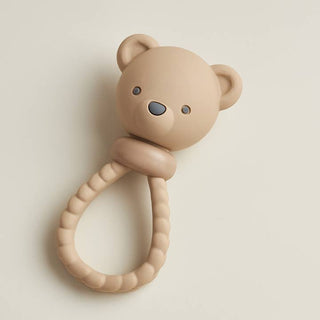 Itzy Ritzy Sweetie Rattle™ - Bear
Beige teddy bear-shaped teething ring on a light beige background