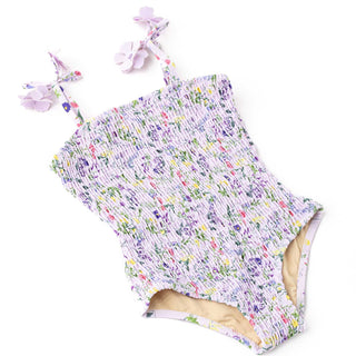 Shade Critters Girls Smocked One Piece Swimsuit - Wildflower Fields
Floral-patterned baby romper with matching headband on a white background