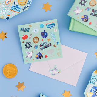 Jollity & Co Festival of Lights Sticker Set 
Colorful Hanukkah card with decorative elements on a blue background