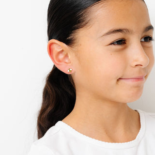 Pip Pop Post Earrings - Bee
Close-up of a girl wearing a gold earring on a white background