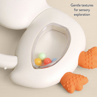 Itzy Ritzy Bitzy Shake silicone teether with rattle in goose design, soft and colorful baby teething toy for soothing gums.