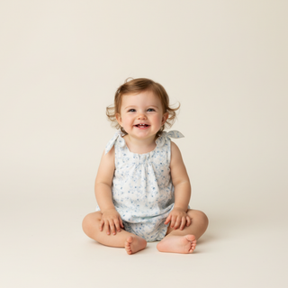 Makemake Organics organic tie shoulder bubble romper with ivy floral print, lightweight and stylish for warm weather.