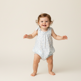Makemake Organics organic tie shoulder bubble romper in ivy floral print, lightweight and stylish for warm weather.