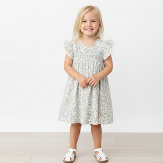Makemake Organics organic short sleeve flutter dress with tulle floral design, featuring a lightweight, feminine style and vibrant floral pattern.