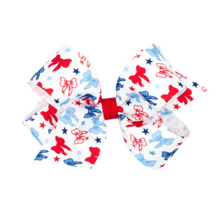Wee Ones patriotic printed grosgrain hair bow on clip, featuring red, white, and blue stars and stripes for girls.