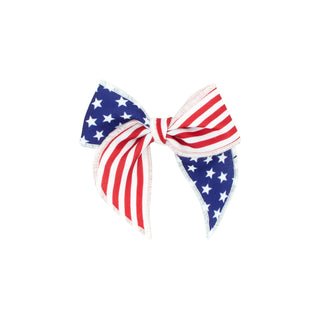 Whimsy Tail Hair Bow on Clippie by Wee Ones featuring a colorful American print for young children.