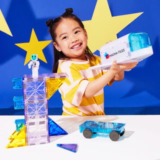 Magna-Tiles Space™ 32-Piece Set
Child playing with Magna-Tiles toy set against a blue background with yellow stars