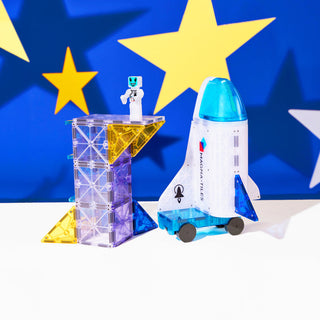 Magna-Tiles Space™ 32-Piece Set
Toy rocket and robot on a stand with a blue background featuring yellow stars