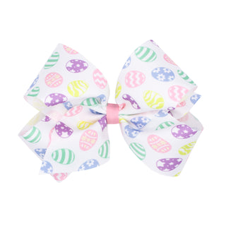 Large hair bow with Easter egg pattern on a white background
