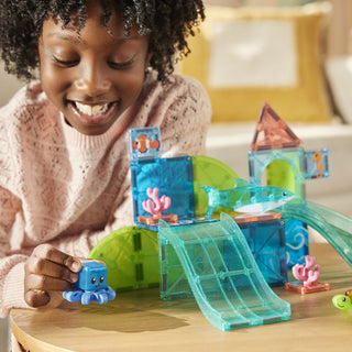 Magna-Tiles Coral Reef™ 25-Piece Set (Copy)
Child playing with a toy aquarium set on a table