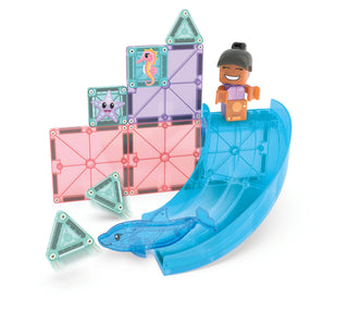 Magna-Tiles Dolphin Bay™ 13-Piece Set
Magnetic building toy set with translucent pink, blue, and purple tiles, a blue slide, fish pieces, and a small character figure on a white background.