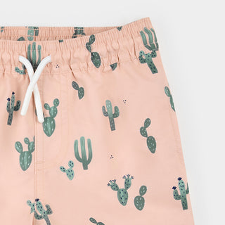Petit Lem coral swim trunks with cactus print, featuring a vibrant design for children's swimwear.