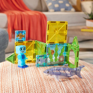 Magna-Tiles Shark Dive™ 13-Piece Set
Colorful toy set with transparent pieces and characters on a textured surface.
