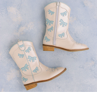 Wild & Rae baby blue cowgirl boots with bow, stylish western footwear for girls, featuring decorative details and comfortable design.