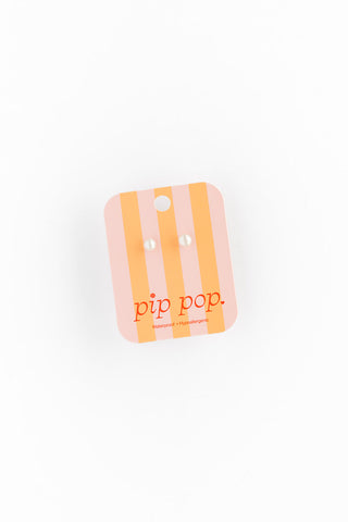 Pip Pop Post Pearl Earrings featuring elegant white pearls on silver posts, perfect for a stylish and sophisticated look.
