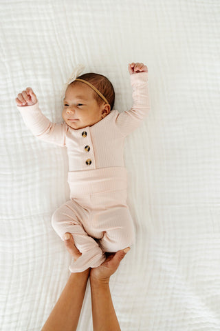 Lou Lou and Company Ribbed Top and Bottoms outfit set for toddlers, featuring a cozy ribbed fabric in pink and white.
