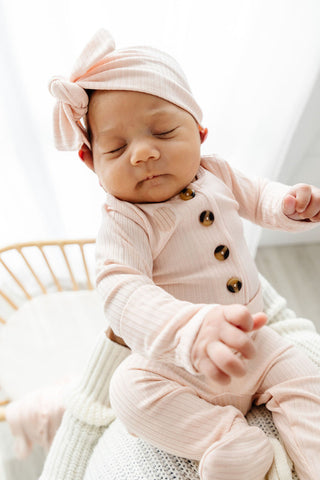 Lou Lou and Company Ribbed Top and Bottoms outfit set featuring a cozy, pink ribbed fabric for infants or toddlers.