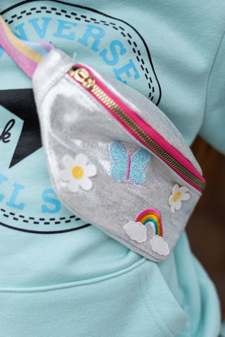 Great Pretenders rainbows and butterflies fanny pack with colorful rainbow and butterfly design, adjustable strap and zip closure.