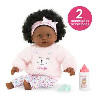 Corolle 12" Doll - Bébé Calin - Caroline
Doll with curly hair wearing a pink outfit with a bear design, sitting next to a bottle with accessories on a white background.