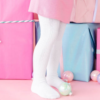 Little Stocking Co Cable Knit Tights - White
White knee-high socks worn with colorful gift boxes in the background