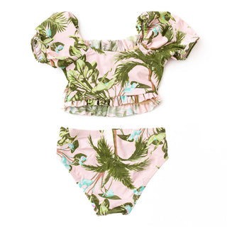 Shade Critters Girls Smocked Puff Sleeve Two Piece Swim Set - Blush Tropics
Two-piece swimsuit with tropical leaf pattern on a white background